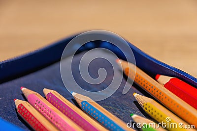 A school folder with colored pencils Stock Photo