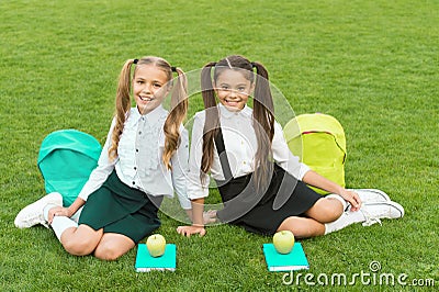 School friends relaxing after classes at school yard, soulmates concept Stock Photo