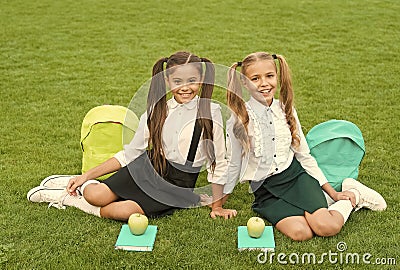 School friends relaxing after classes at school yard, soulmates concept Stock Photo