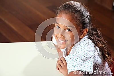 School girl 10 relaxed while sitting at her classr Stock Photo