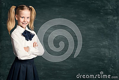 School Girl Child on Blackboard Background, Happy Pupil Kid in Retro Dress over Black Board Stock Photo