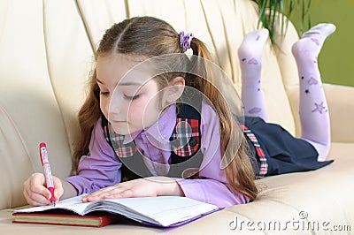 School girl doing homeworks Stock Photo