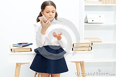 school girl has call in classroom, childhood. school girl has call at the desk. school girl has call Stock Photo