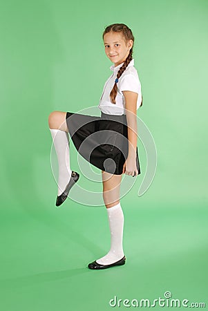 School girl pretty tomboy raising her leg Stock Photo
