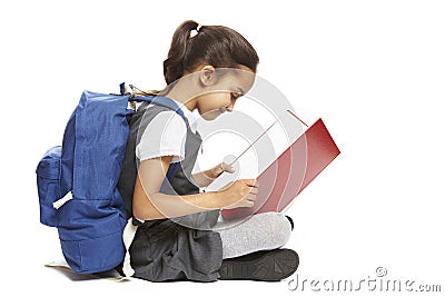 School girl sitting reading book Stock Photo