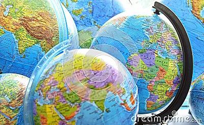 School globes of the planet Earth with a world map. Back to school. Stock Photo