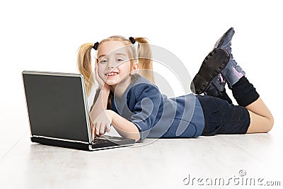 School Kid Girl Learning Computer. Children Online Education Concept. Little Girl lying down over White Studio Background Stock Photo