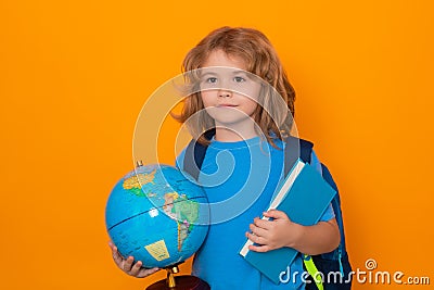 School kid portrait. Schoolboy with world globe and book. School child student with backpack. Elementary school child Stock Photo