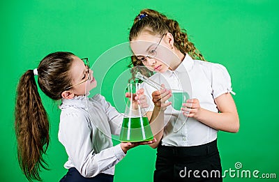 School kid scientist studying science. biology education. little smart girls with testing flask. children study Stock Photo