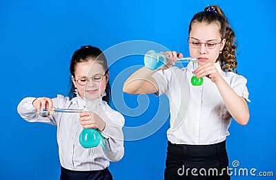 School kid scientist studying science. little smart girls with testing flask. children study chemistry lab. biology Stock Photo