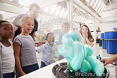 School kids watching an experiment at a science centre Stock Photo