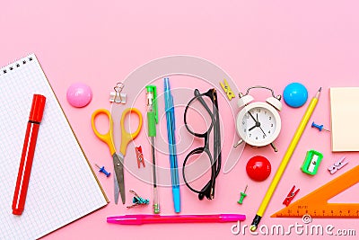 School notebook and office supplies on a pink background. Back to school Stock Photo