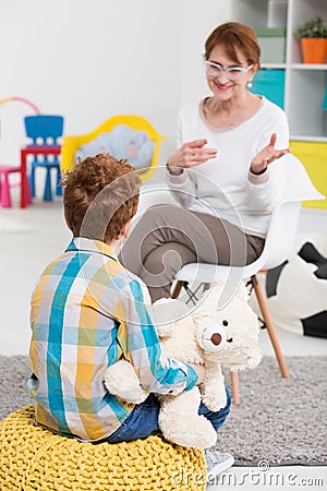 School pedagogue talking with pupil Stock Photo