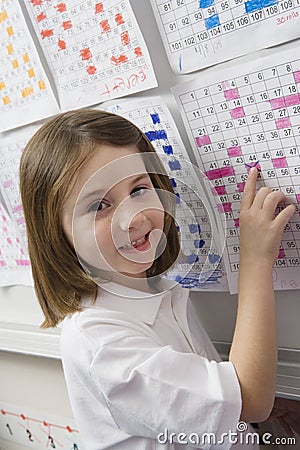 School Pointing To A Date On Schedule Stock Photo