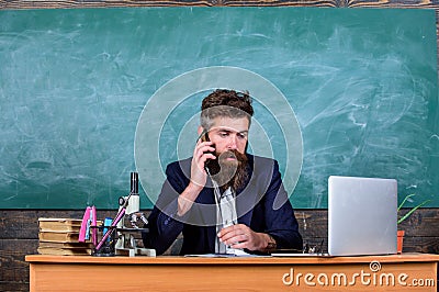 School principal or teacher calling parents to report about exam results. School teacher cares about communication with Stock Photo