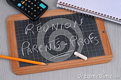School slate on which is written in french meeting parents - teachers Stock Photo