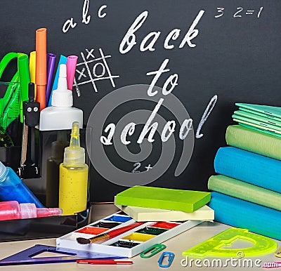School stationery laid on a background of chalkboard Stock Photo