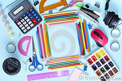 school stationery scattered on a blue in the veda frame with space for text Stock Photo