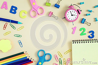 School and stationery are scattered on the bright table. In the center there is an empty space for an inscription or Stock Photo