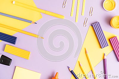 School stationery scattered on purple background Stock Photo