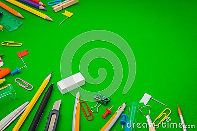 School supplies on Green chalkboard Back to school background Stock Photo