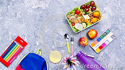 School supplies and lunchbox with food for kids. Colorful stationery layout on multicolor background, copy space Stock Photo