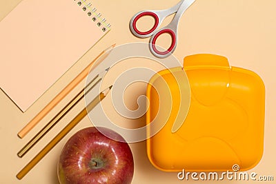 School supplies. Notebook, color pencils and lunch box Stock Photo
