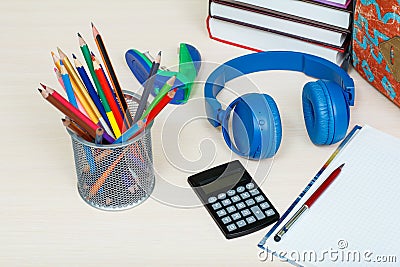 School supplies. School backpack, books, metal stand for pencils Stock Photo