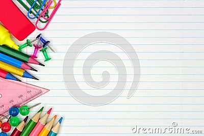 School supplies side border on lined paper background Stock Photo