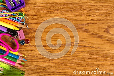 School supplies side border on wood desk Stock Photo