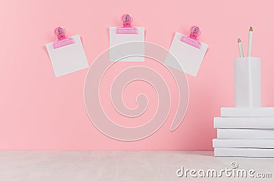 School template - white books, stationery, blank stickers, decorative balloons origami on white desk and soft pink background. Stock Photo