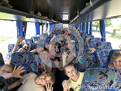 A school trip on a bus, young Polish students greeting Editorial Stock Photo