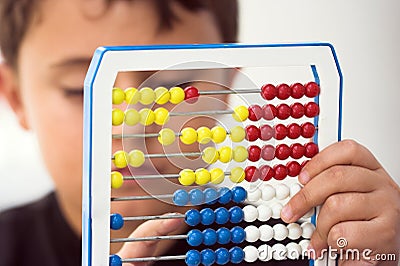 Schoolboy calculate with abacus Stock Photo