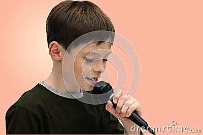 Schoolboy giving a performance and entertains the people Stock Photo