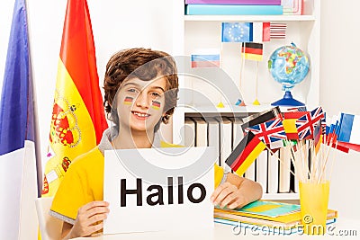 Schoolboy learning German at the light classroom Stock Photo