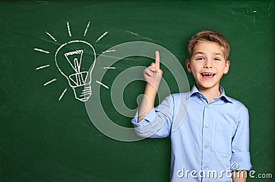 Schoolboy with light bulb Stock Photo