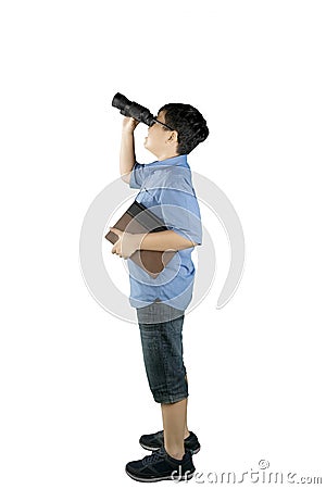 Schoolboy looking at something with a binocular Stock Photo