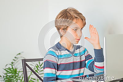 A schoolboy for online learning in front of computer Stock Photo