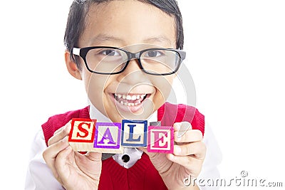 Schoolboy with SALE word Stock Photo