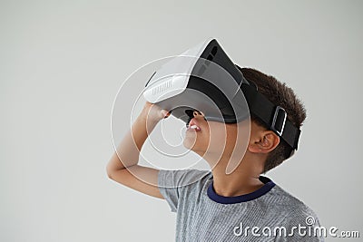 Schoolboy using virtual reality headset Stock Photo