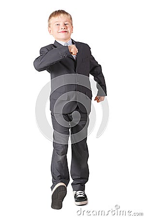 Schoolboy wearing accurate suit is walking Stock Photo