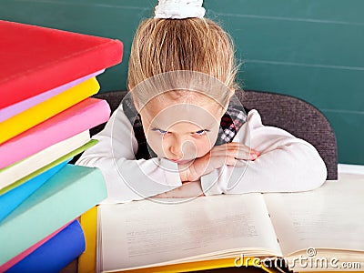 Schoolchild in classroom near blackboard. Stock Photo