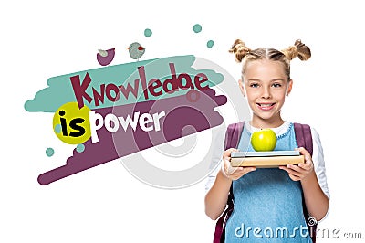 schoolchild holding apple on books Stock Photo