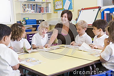 Schoolchildren and their teacher in class Stock Photo