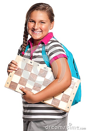 Schoolgirl with chessboard Stock Photo