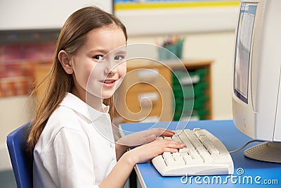 Schoolgirl In IT Class Using Computer Stock Photo