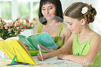 Schoolgirl doing homework Stock Photo