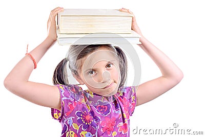 Schoolgirl with pile of books on head Stock Photo