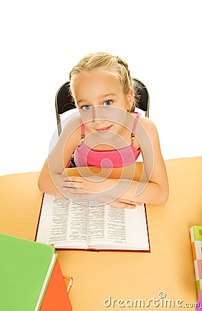 Schoolgirl reading a book Stock Photo