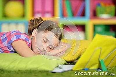 Schoolgirl sleeping on exercise book Stock Photo